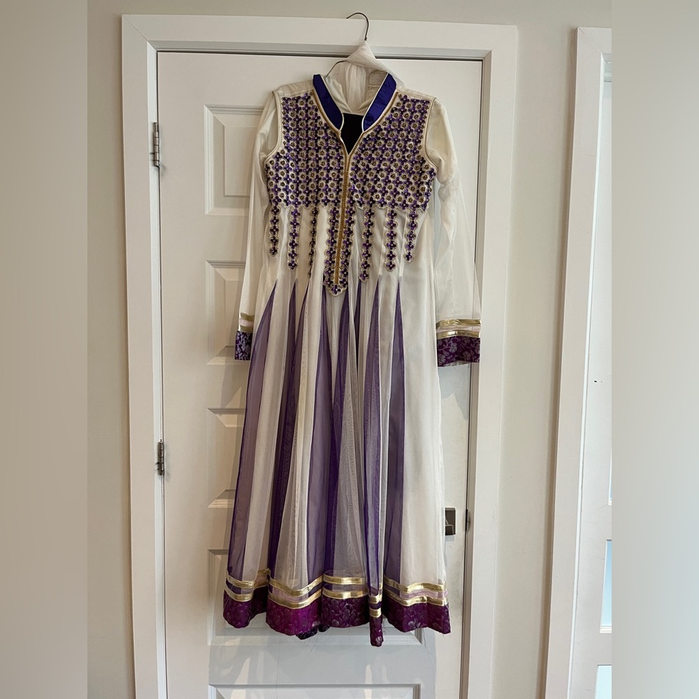 Full 3 piece anarkali with white net dupatta and white pants.